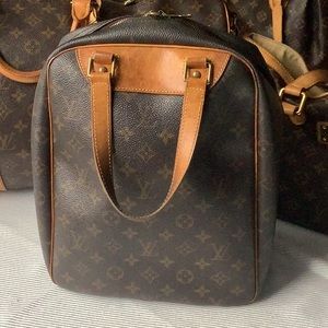 Louis Vuitton. Authentic. Monogram Excursion.